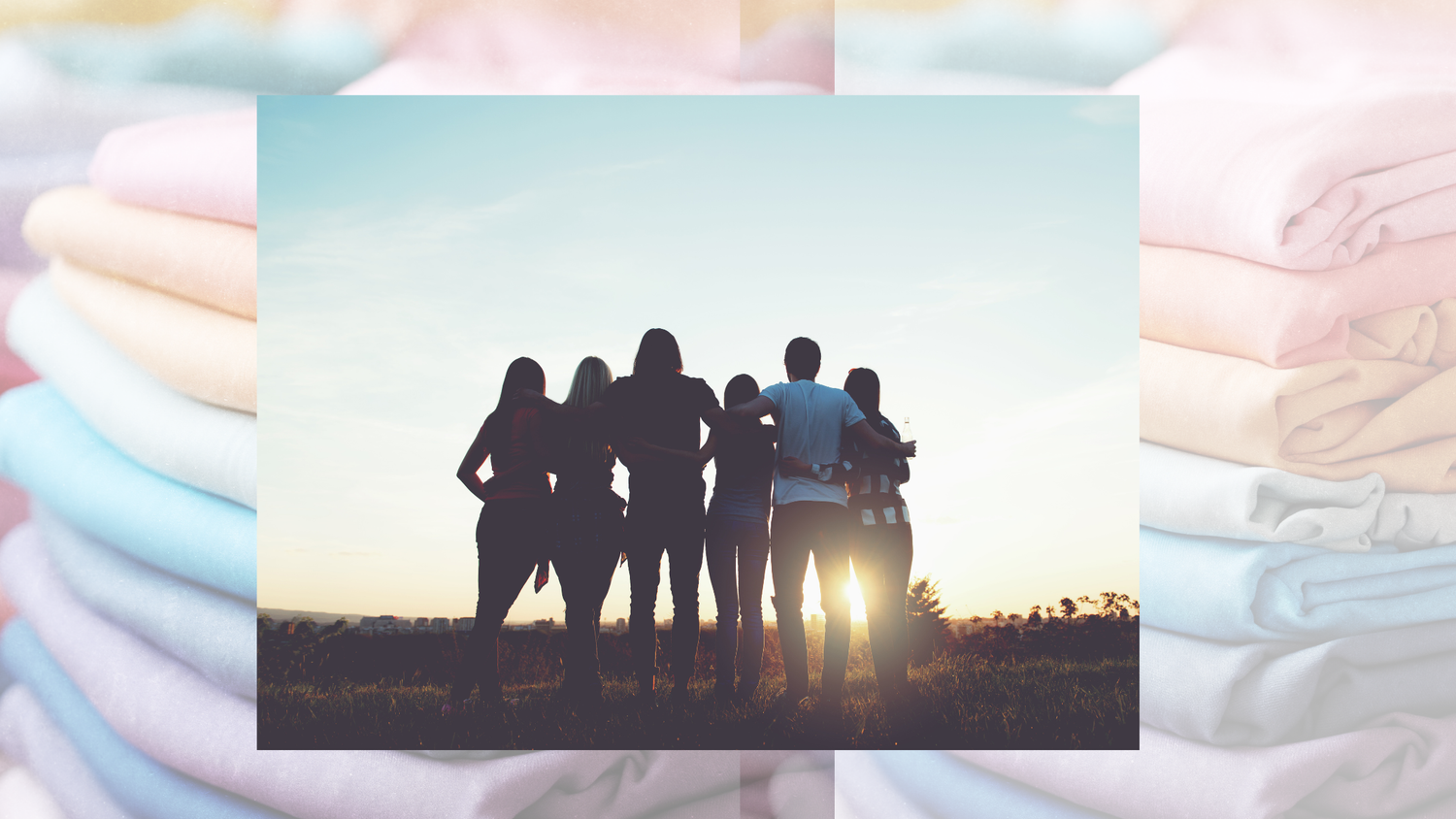 people hugging staring at sunset